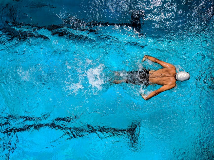 Man swimming laps for cardio exercise