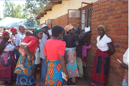 the people of Malawi standing with Dr. Edwards, Princeton internist